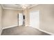 Bedroom with neutral walls, carpeted floor, and a spacious closet at 3407 Cason Rd, Plant City, FL 33566