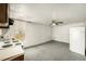 This kitchen features dark appliances and worn cabinets with an open floor plan at 3407 Cason Rd, Plant City, FL 33566
