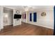 Inviting living room with wood floors, ceiling fan, and neutral paint at 3407 Cason Rd, Plant City, FL 33566