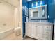 Elegant bathroom with vanity, well-lit mirror, and a clean, functional shower and bathtub at 3408 90Th N Ter, Pinellas Park, FL 33782