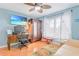 Bright bedroom featuring a ceiling fan, and natural light from the window, and a large wardrobe at 3408 90Th N Ter, Pinellas Park, FL 33782