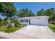 Charming single-story home featuring a well-manicured front yard and a spacious two-car garage at 3408 90Th N Ter, Pinellas Park, FL 33782
