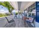 Inviting front porch featuring stylish seating and nautical decor, perfect for relaxing outdoors at 3408 90Th N Ter, Pinellas Park, FL 33782