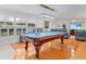 Game room featuring a pool table, wood floors, and a view into the living room at 3408 90Th N Ter, Pinellas Park, FL 33782
