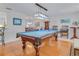 Spacious game room featuring a well-maintained pool table with blue felt and a decorative overhead light fixture at 3408 90Th N Ter, Pinellas Park, FL 33782