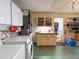 Features utility appliances and ample storage with upper and lower cabinets at 3408 90Th N Ter, Pinellas Park, FL 33782