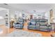 Bright and spacious living room with a comfortable seating arrangement and view into the open kitchen at 3408 90Th N Ter, Pinellas Park, FL 33782