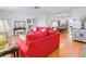 Open-concept living room that flows into the dining area with hardwood floors at 3408 90Th N Ter, Pinellas Park, FL 33782