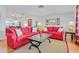 Bright living room with hardwood floors, comfortable seating, and stylish decor at 3408 90Th N Ter, Pinellas Park, FL 33782