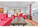 Inviting living room with hardwood floors, bright natural light, and cozy furnishings at 3408 90Th N Ter, Pinellas Park, FL 33782