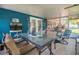 Bright sunroom with a dining table, perfect for enjoying meals with a view of the outdoors at 3408 90Th N Ter, Pinellas Park, FL 33782