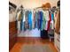 Walk-in closet with ample hanging space, wooden floors, and built-in drawers for maximum organization at 3408 90Th N Ter, Pinellas Park, FL 33782
