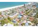 Aerial view of the property near the beach, showing its location, surrounding neighborhood, and proximity to the ocean at 3516 Casablanca Ave, St Pete Beach, FL 33706