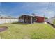 Spacious backyard with a screened-in porch at 3516 Casablanca Ave, St Pete Beach, FL 33706