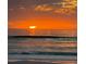 Beautiful ocean view with golden sunrise and calming waves at 3516 Casablanca Ave, St Pete Beach, FL 33706