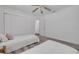 Bright bedroom featuring two beds, wood-look floors, and a closet at 3516 Casablanca Ave, St Pete Beach, FL 33706