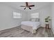 Cozy bedroom with natural light, neutral tones, and wood-look flooring at 3516 Casablanca Ave, St Pete Beach, FL 33706