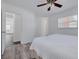 Bright bedroom with wood-look floors and a walk-in closet at 3516 Casablanca Ave, St Pete Beach, FL 33706