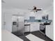 Modern kitchen featuring white cabinets, stainless steel appliances, and a sleek countertop at 3516 Casablanca Ave, St Pete Beach, FL 33706