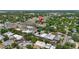 Scenic aerial view showcasing neighborhood with buildings and lush greenery at 38351 7Th Ave, Zephyrhills, FL 33542