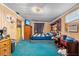 Bedroom featuring blue carpet, a closet, and a window for natural light at 38351 7Th Ave, Zephyrhills, FL 33542