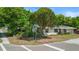 Corner lot house surrounded by beautiful green trees at 38351 7Th Ave, Zephyrhills, FL 33542