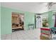 Bright and spacious living room featuring tiled flooring, doorway to another room, and front door access at 38351 7Th Ave, Zephyrhills, FL 33542