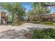A street view showing shade trees and a road with a sidewalk at 38351 7Th Ave, Zephyrhills, FL 33542