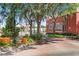 A street view with well-maintained landscaping and a brick building in the background at 38351 7Th Ave, Zephyrhills, FL 33542