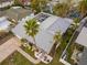 Aerial view of a well-maintained home with a nicely landscaped yard and gray rooftop at 3981 Mckay Creek Dr, Largo, FL 33770
