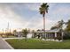 Charming single-story home with a well-manicured lawn, palm trees, and inviting curb appeal at 3981 Mckay Creek Dr, Largo, FL 33770