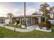 Beautiful home featuring manicured landscaping, a brick pathway, and a welcoming front porch at 3981 Mckay Creek Dr, Largo, FL 33770