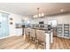Bright kitchen with white cabinets, stainless appliances, and island with barstool seating at 3981 Mckay Creek Dr, Largo, FL 33770