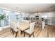 Open layout shows kitchen with stainless appliances open to the dining area at 3981 Mckay Creek Dr, Largo, FL 33770