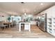 Bright kitchen with white cabinets, stainless appliances, and large island with seating at 3981 Mckay Creek Dr, Largo, FL 33770