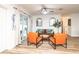 Inviting living room featuring modern seating, a ceiling fan, and sliding glass doors to the patio at 3981 Mckay Creek Dr, Largo, FL 33770
