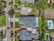 Aerial view of a beautiful home with a pool and well-manicured landscaping at 4607 W Lamb Ave, Tampa, FL 33629