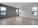 Bright, airy bedroom features wood-look flooring, modern trim, and large windows for natural light at 4607 W Lamb Ave, Tampa, FL 33629