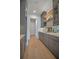 Gray butler pantry with lots of storage, granite countertop, and wood shelving at 4607 W Lamb Ave, Tampa, FL 33629