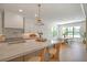 Bright kitchen with a large island, marble countertops, and stainless steel appliances at 4607 W Lamb Ave, Tampa, FL 33629