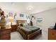 Comfortable bedroom with wall decor, a patterned comforter, and a window at 4725 Royal Birkdale Way, Wesley Chapel, FL 33543