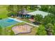 Community playground area includes swings, basketball court and covered picnic area at 4725 Royal Birkdale Way, Wesley Chapel, FL 33543
