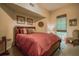 Cozy bedroom with warm lighting, comfortable bed, and a stylish chair with a window view at 504 S Armenia Ave # 1338, Tampa, FL 33609
