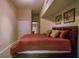 Bedroom featuring neutral walls with glimpses of the ensuite bathroom at 504 S Armenia Ave # 1338, Tampa, FL 33609
