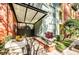Inviting entryway featuring a covered walkway, lush planters, and handicap access ramp at 504 S Armenia Ave # 1338, Tampa, FL 33609