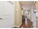 Bright hallway with wood floors and white trim, leading to the living areas at 504 S Armenia Ave # 1338, Tampa, FL 33609