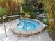 Relaxing hot tub surrounded by bamboo, greenery, and a bench at 504 S Armenia Ave # 1338, Tampa, FL 33609