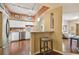 Open concept kitchen with stainless steel appliances, white cabinets, and a view into the living room at 504 S Armenia Ave # 1338, Tampa, FL 33609