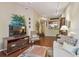 Inviting living room featuring a large TV, bookshelves, and an open layout at 504 S Armenia Ave # 1338, Tampa, FL 33609