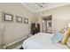 Bright bedroom featuring neutral walls, large artwork and a glimpse of a bathroom at 504 S Armenia Ave # 1338, Tampa, FL 33609